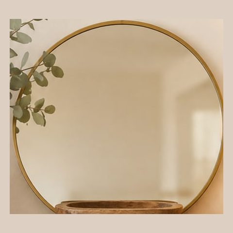Gold round mirror